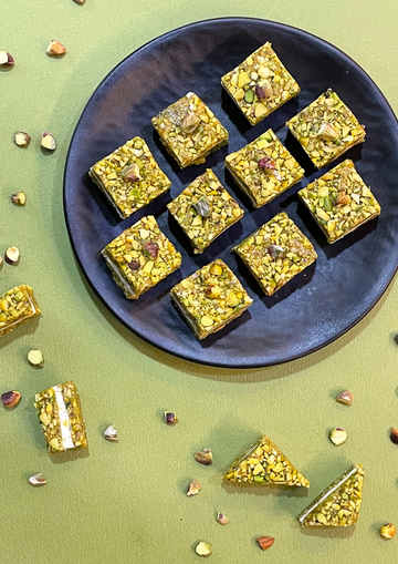 Pistachio crumbles sandwiched with white chocolate  - 250gms